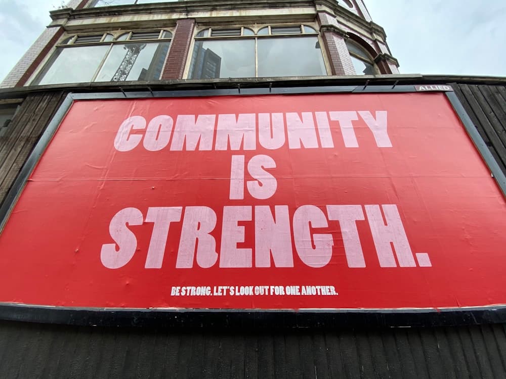 Large printed billboard mounted on a building